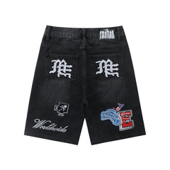 MIXED EMOTION Multi‑Patch Black Denim Jorts