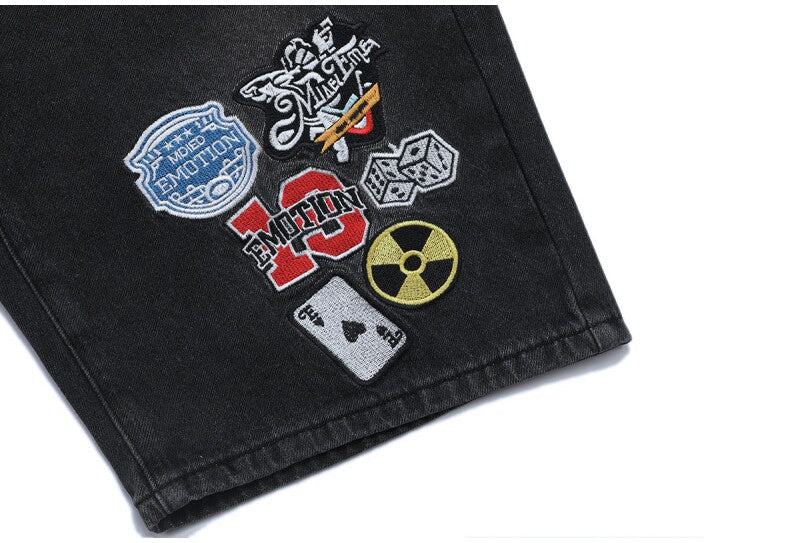MIXED EMOTION Multi‑Patch Black Denim Jorts