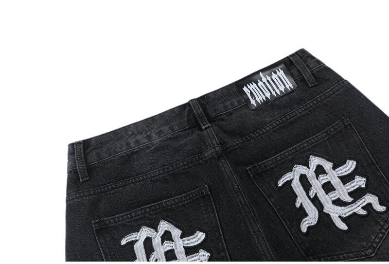 MIXED EMOTION Multi‑Patch Black Denim Jorts